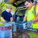 Customer dropping off hazardous household waste at a collection center event